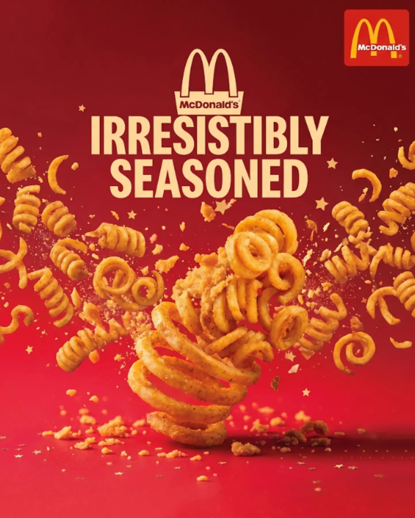 McDonald's poster: curly fries flying through the air on red, headed "Irresistibly seasoned".